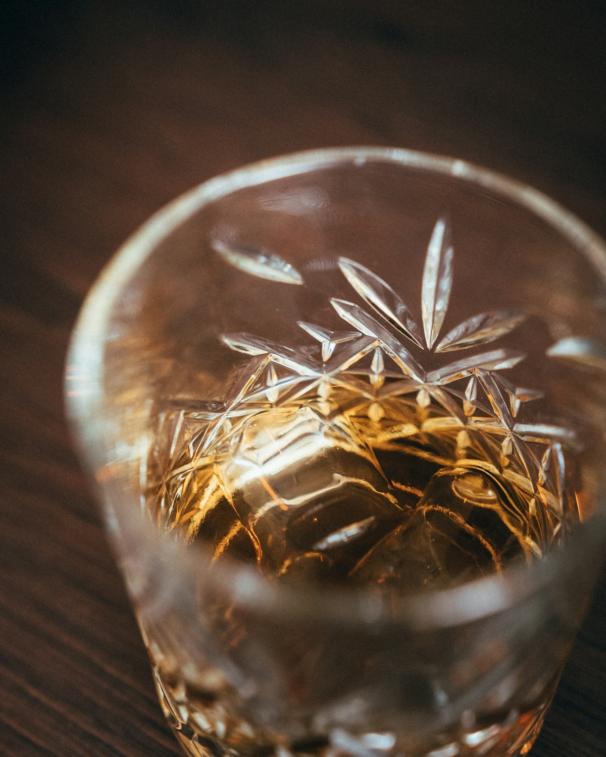 clear drinking glass with brown liquid