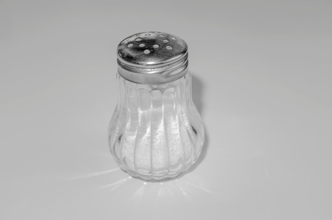 a salt shaker sitting on top of a table