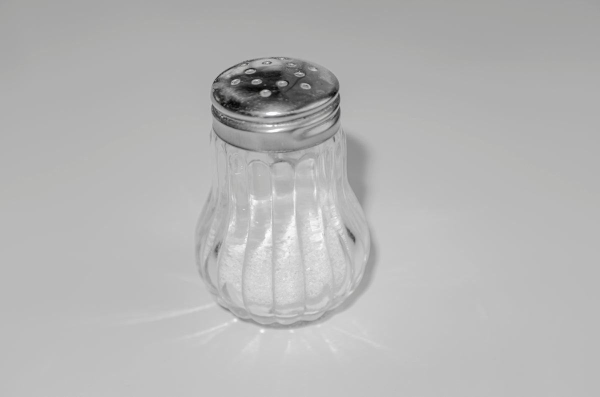 a salt shaker sitting on top of a table