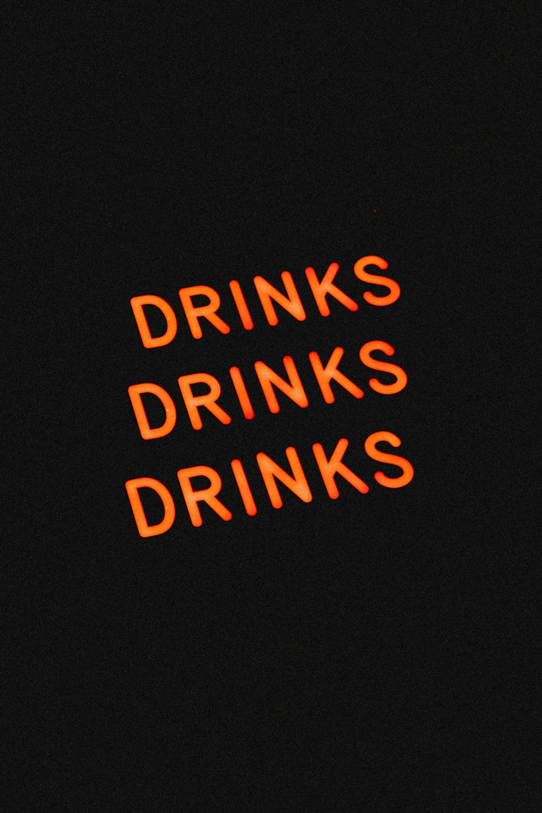 a neon sign that reads drinks drinks drinks drinks