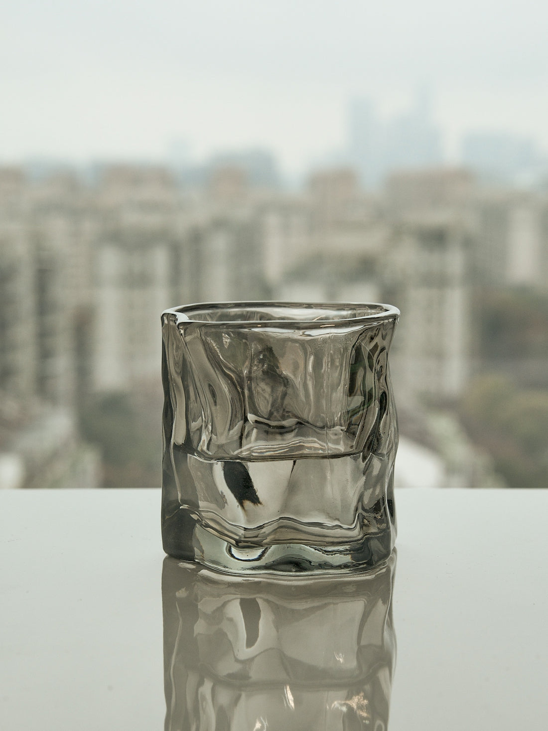 a glass of water sitting on top of a table