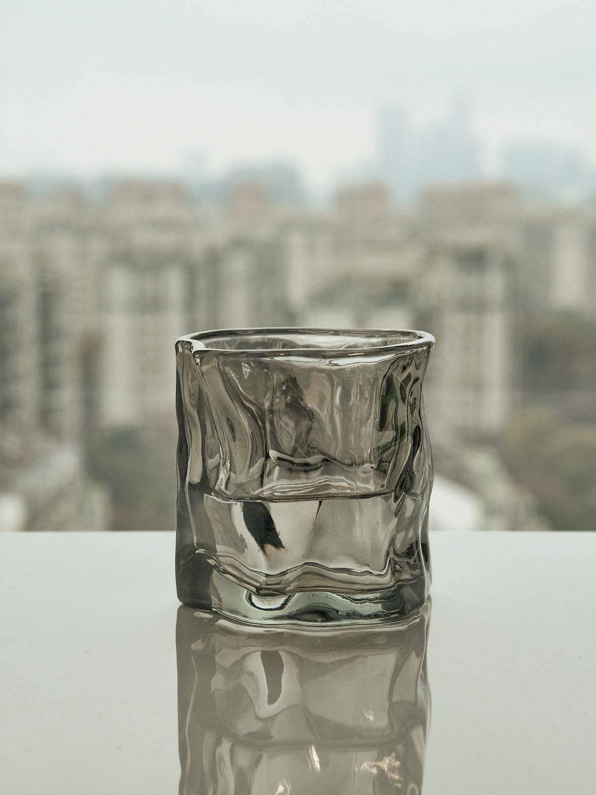 a glass of water sitting on top of a table