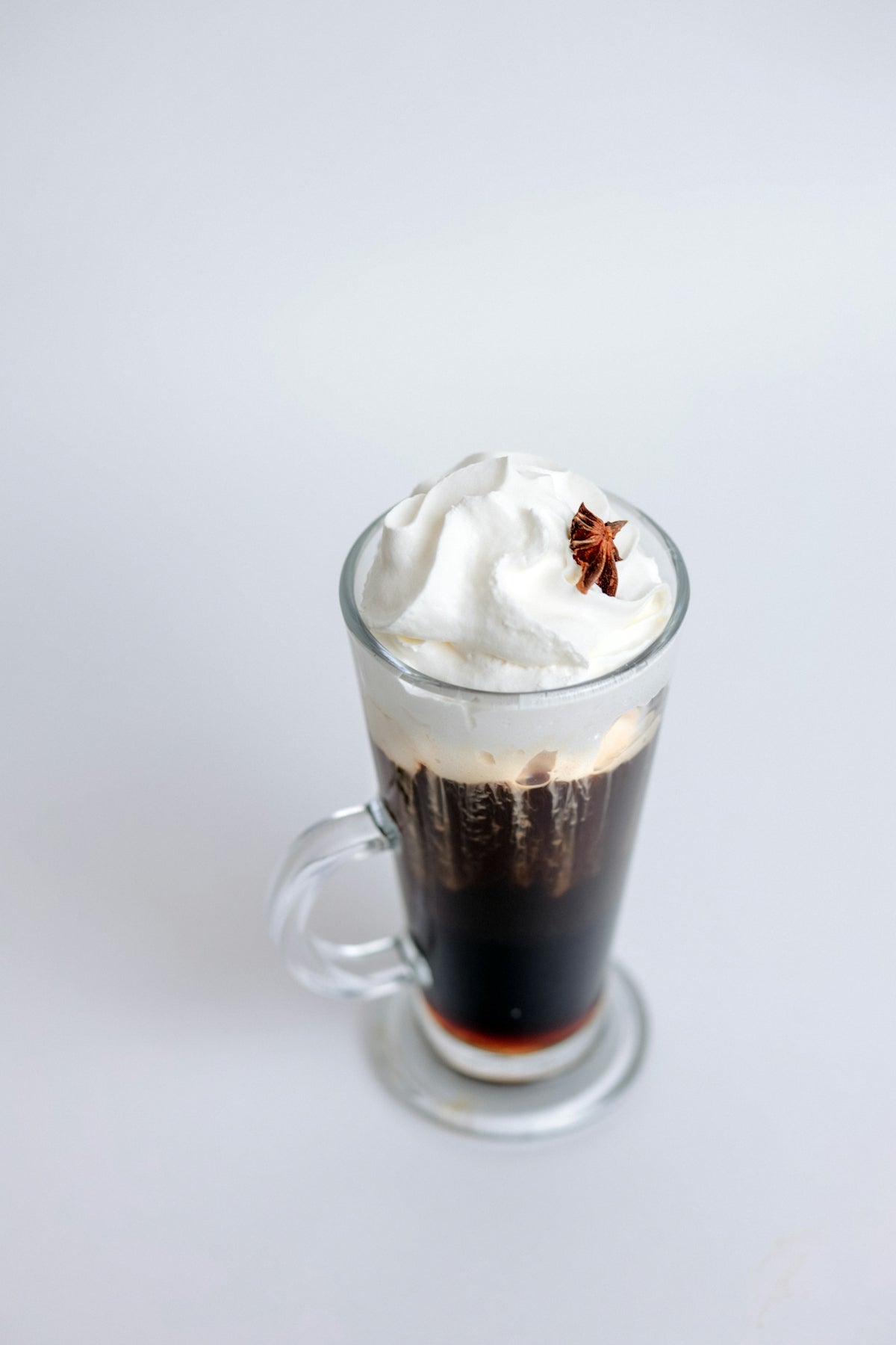 A cup of coffee with whipped cream on top